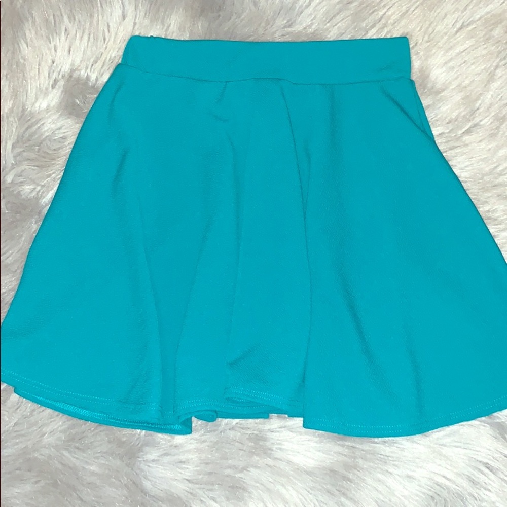 Turquoise skirt.